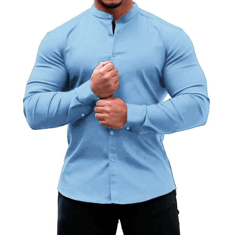 Long sleeve button-down shirt in a solid light blue color worn by a male model.